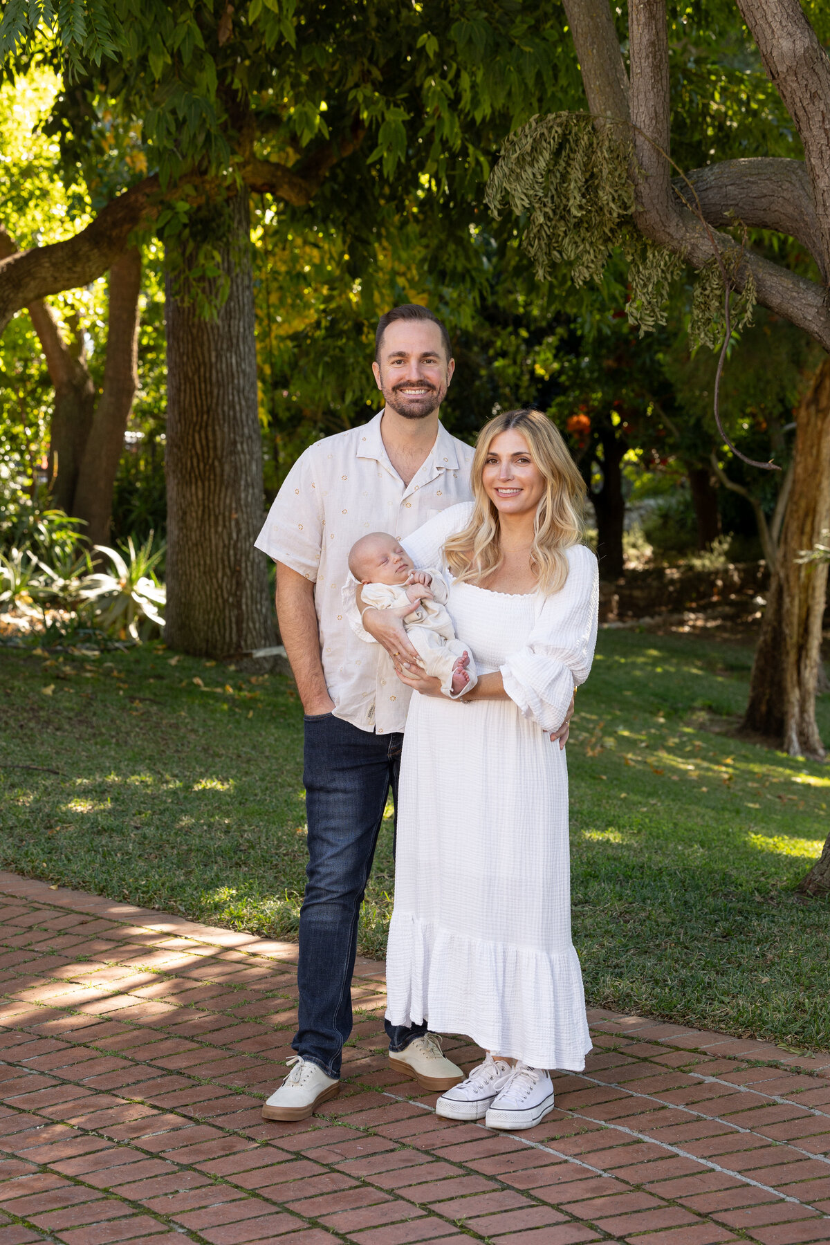 Couple holding a newborn