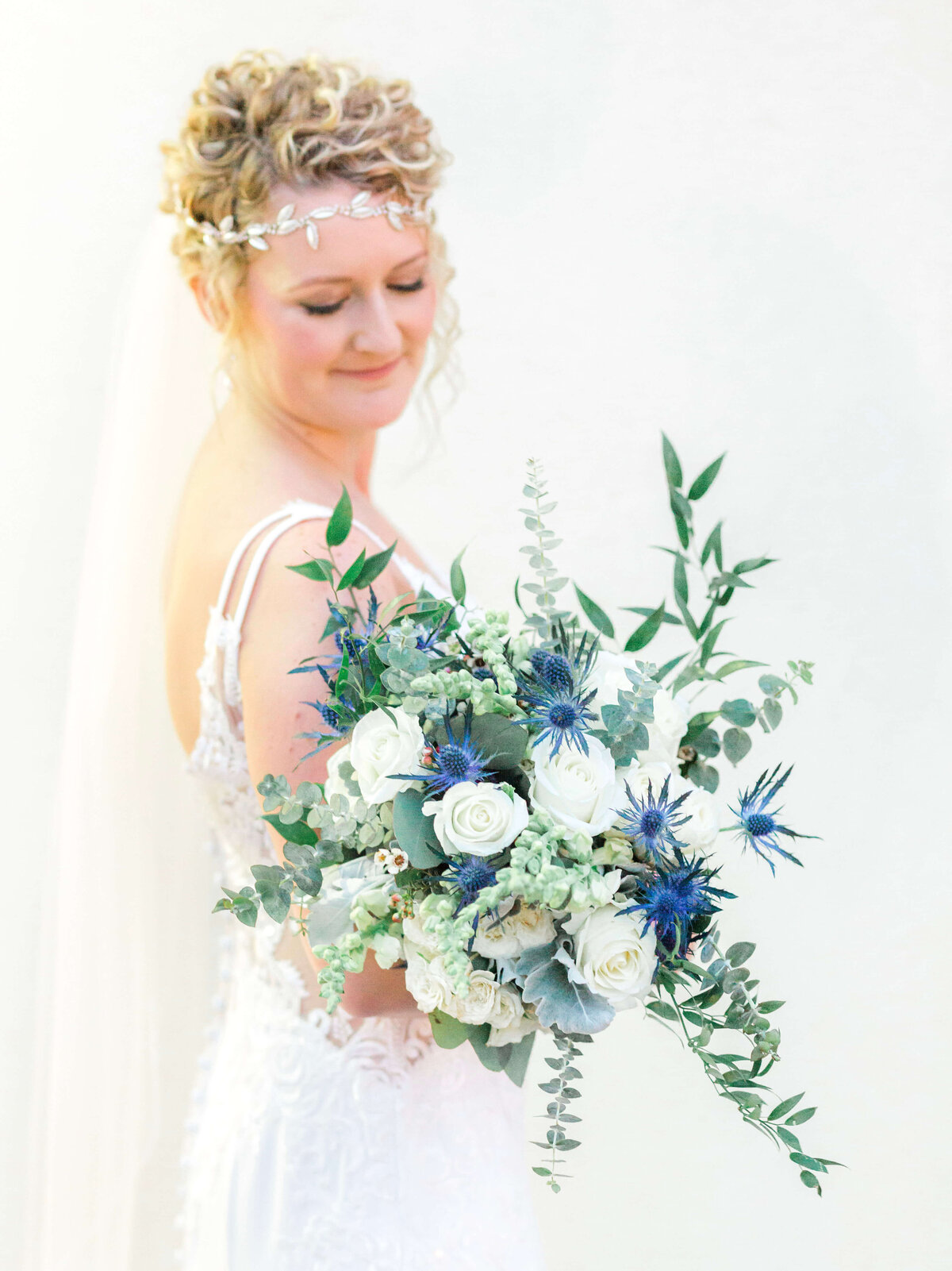 Newport Bride at Gurneys Resort & Marina holding wedding bouquet