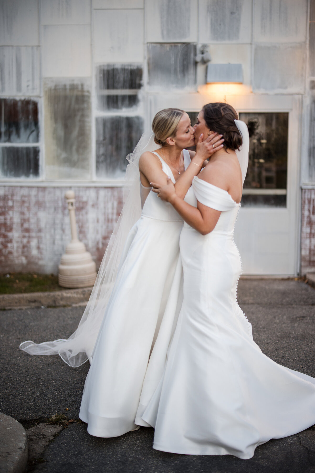 A couple kisses after their ceremony at a  Fairmount Park Horticulture Center wedding