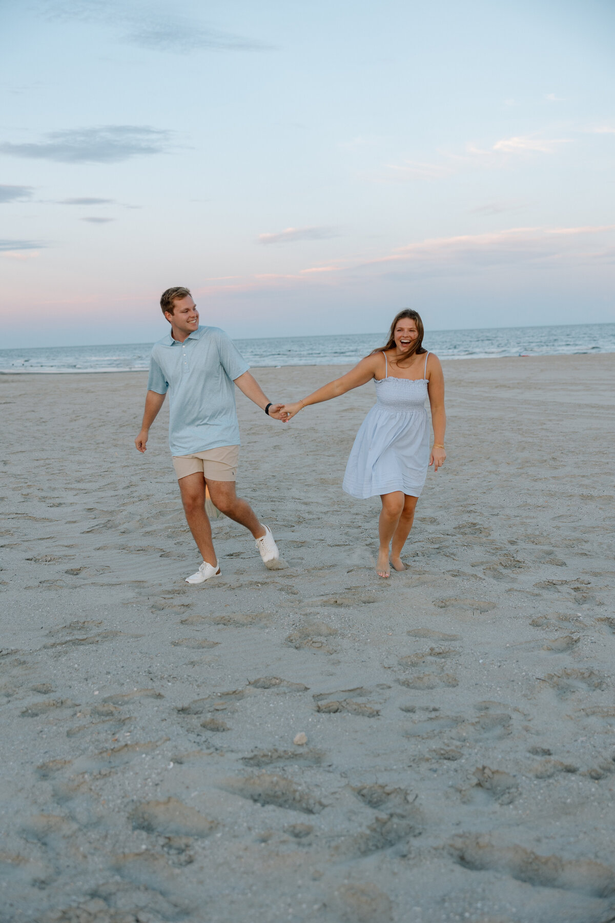 Engaged couple holds hands