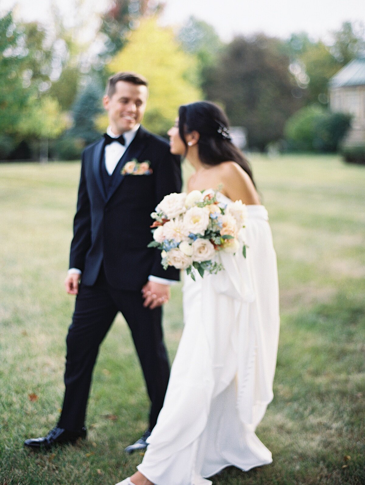 wedding photos chicago of bride and groom walking and holding hands, by Allison Francois Photography