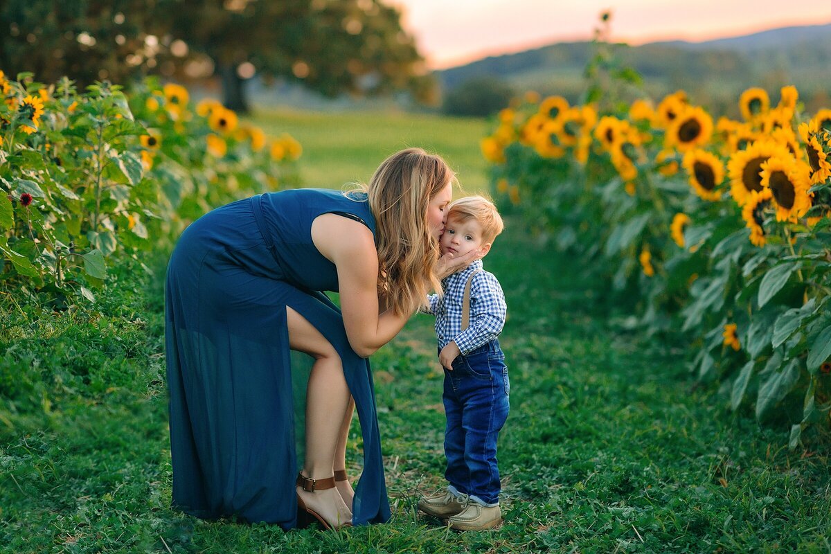 Mom kissing son family photography