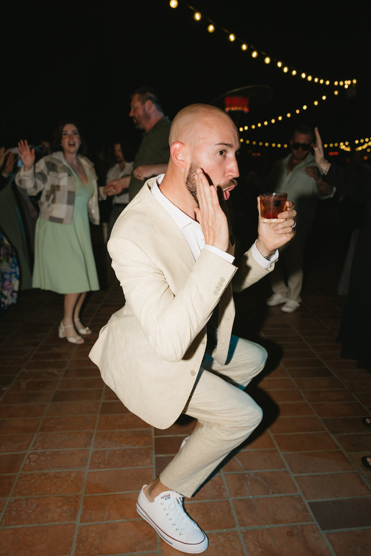 Groom dancing on dance floor at Hilton Beachfront Resort Santa Barbara