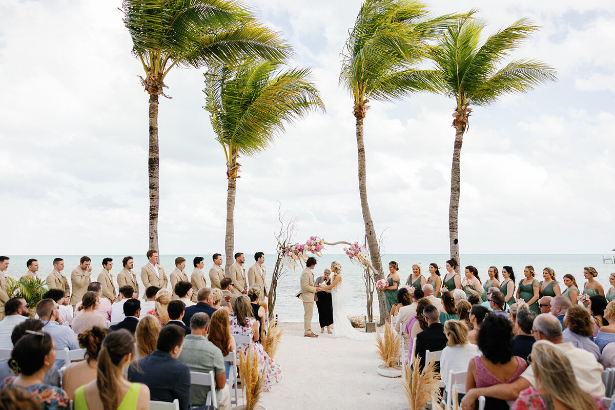 Friends and family witnessing Brenda & Stephen’s beachfront vows at Cheeca Lodge.