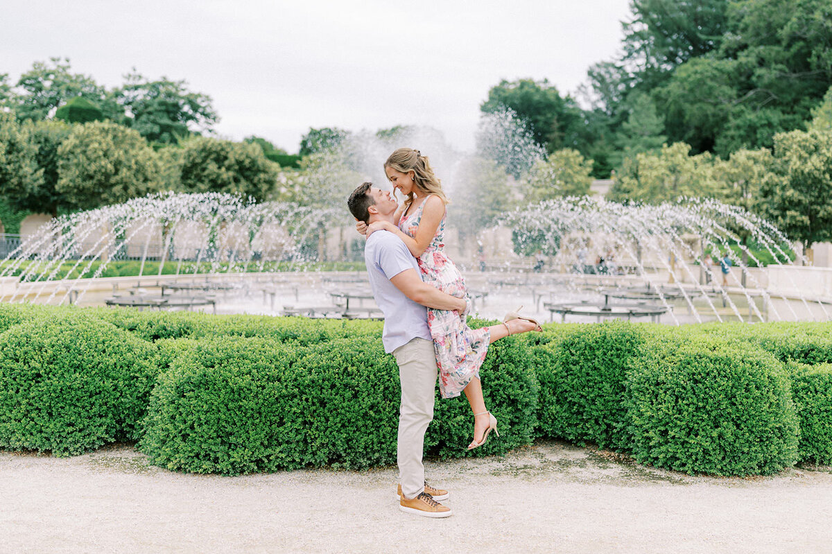 A couple at their floral engagement at Longwood Gardens in Kennett Square, PA