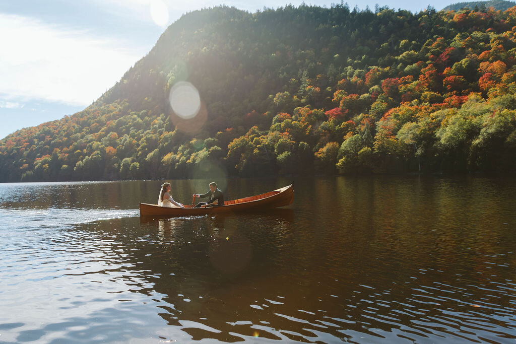 Bride and Groom in Canoe on Lake 