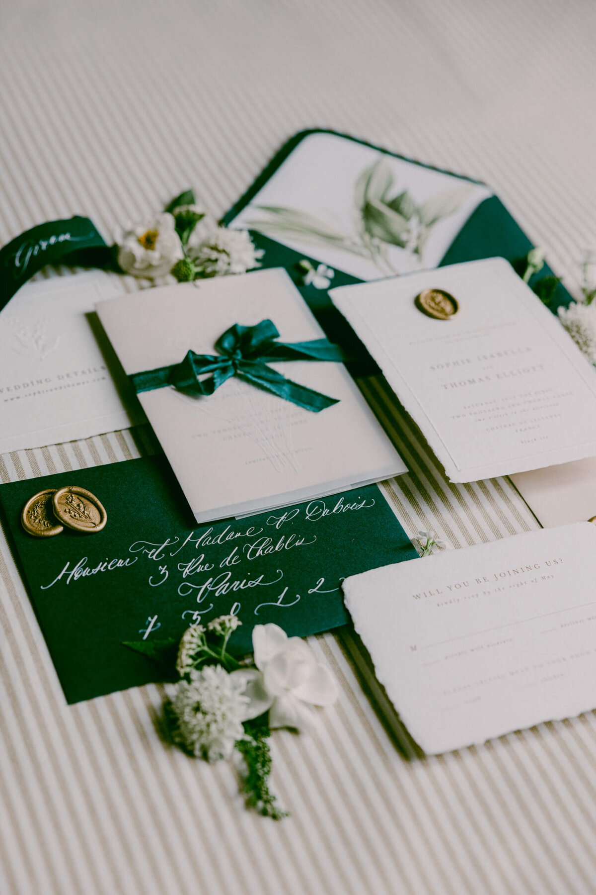A wedding day photo of the bride and grooms wedding invitations at Chateau de Jalesnes in France