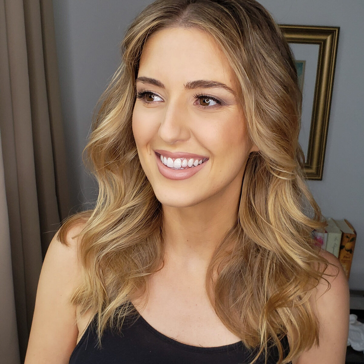 Beauty headshot with glossy eyelids and nude lipstick – styled by Lydia Arroyo.