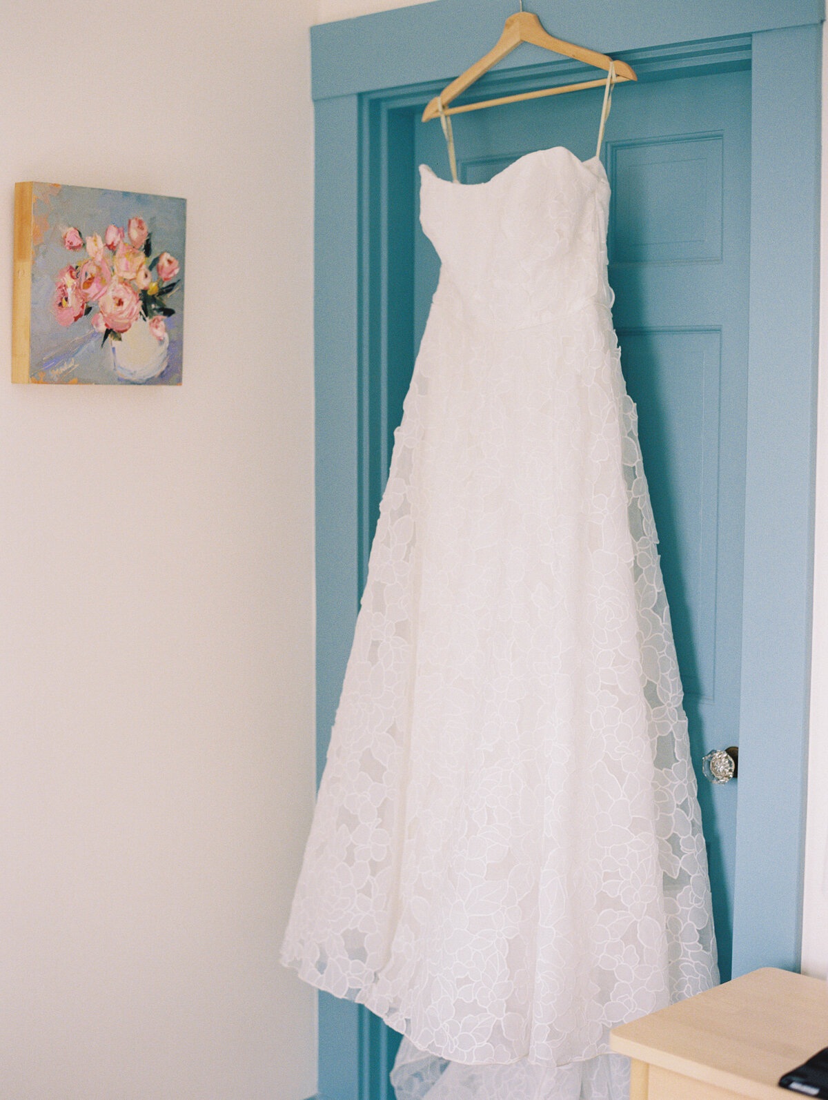 wedding dress on blue door