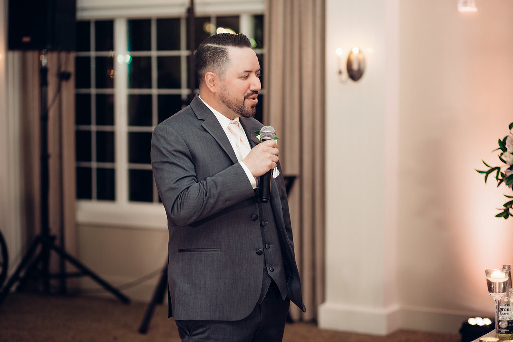 Wedding Photograph Of Man In Gray Suit Speaking Ina Microphone Los Angeles