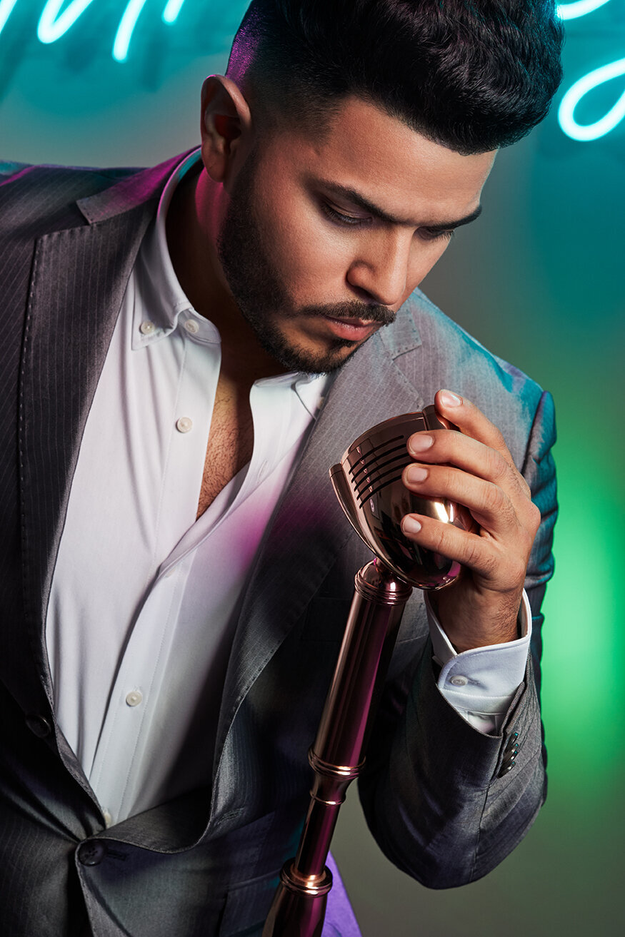 Artistic portrait of Mr. B Styles in a hat and unique outfit, holding a reflective pose, shot by Ylva Erevall.