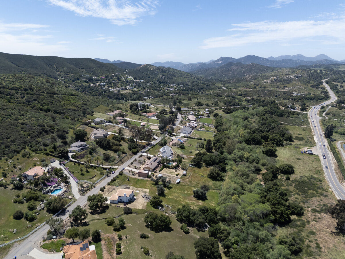 Aerial of Estates golf course and community in Ramona, California. view of the mountains in the distance.