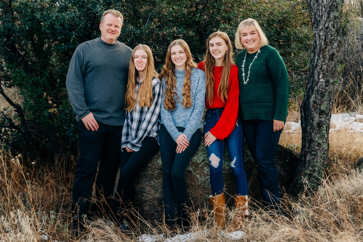 Family poses in front of tree in Prescott family photography session