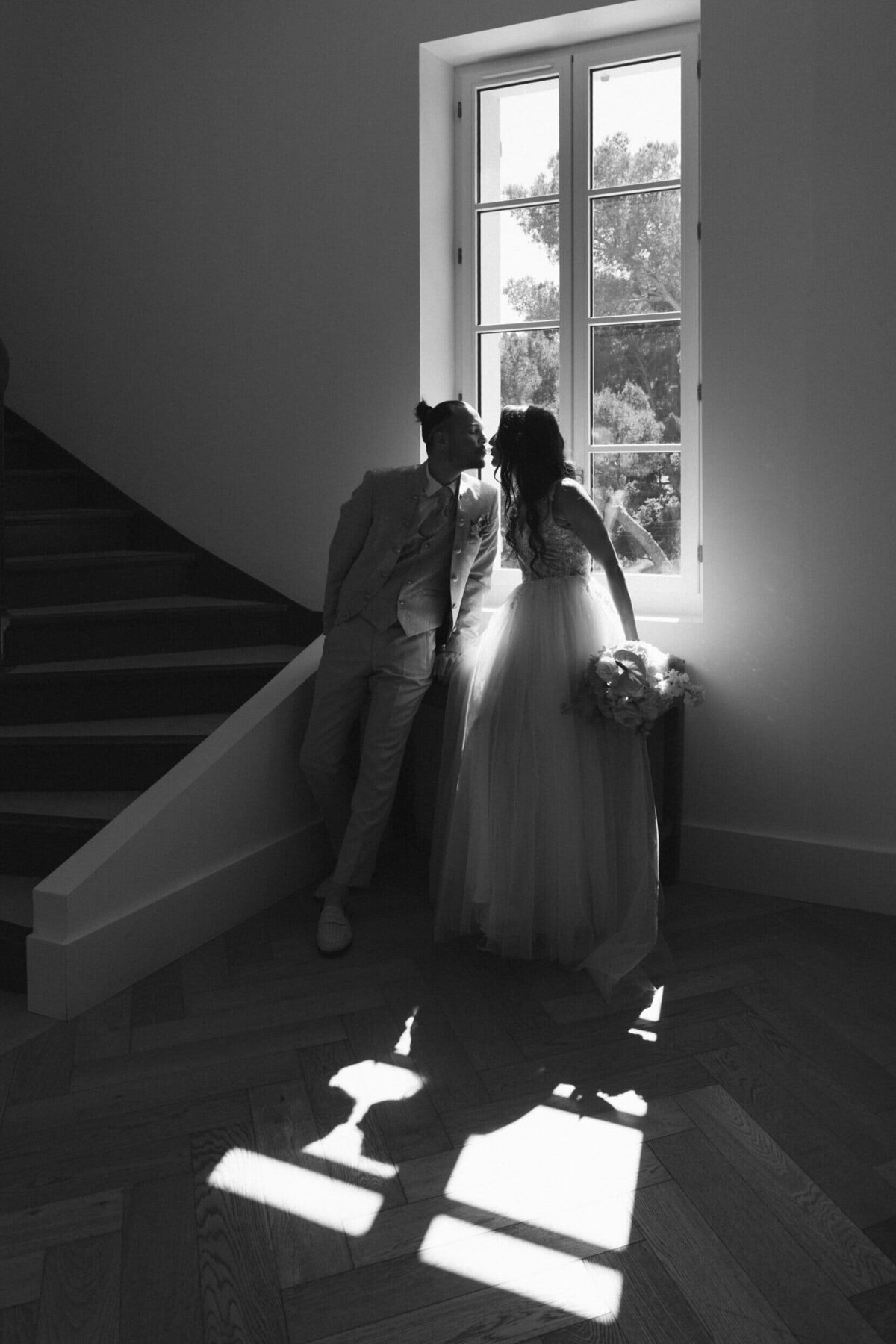 bride-and-groom-by-the-window-with-beautiful-light