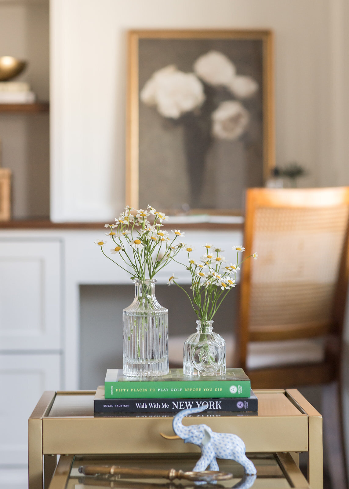melinda chesson interiors boston daisy flowers in vases with glass blue and white elephant