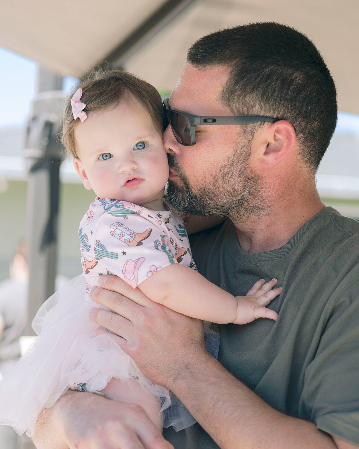 Baby snuggling with dad at a first birthday party in the San Francisco Bay Area, captured by a first birthday party photographer.