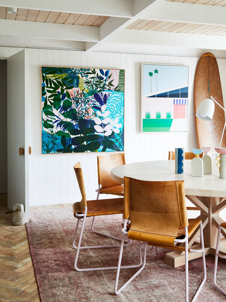 Colourful dining room with bold artwork and natural textures, styled by Melbourne interior designer Lisa Hunter Interiors.