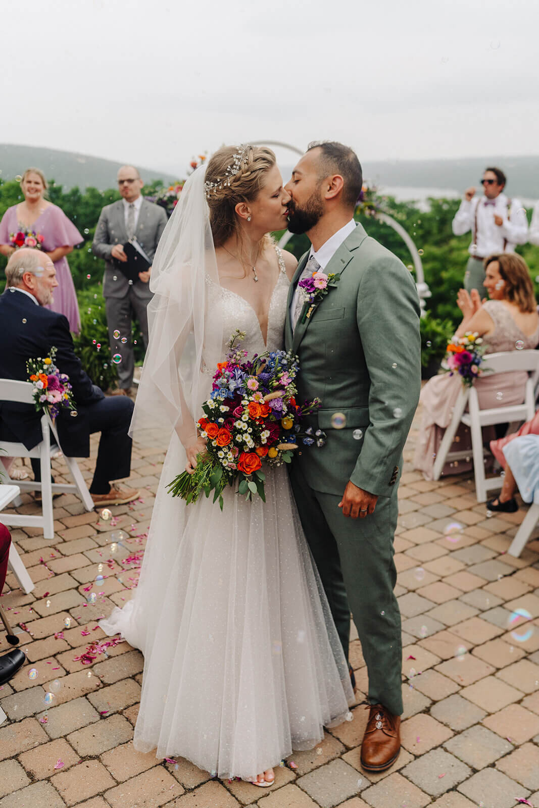 Bride and groom kissing after Keuka Lake wedding ceremony