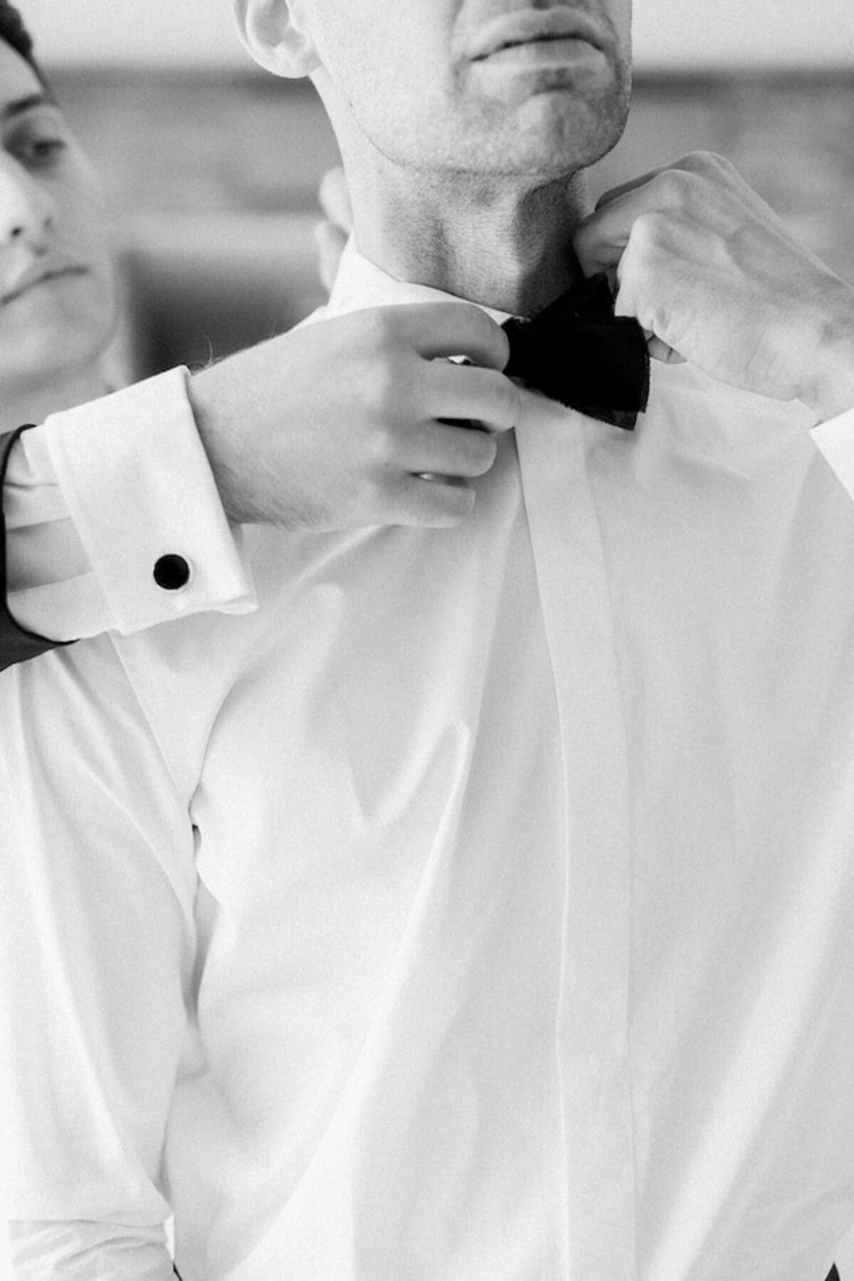 Classic bowtie for a modern groom before a luxury Chicago outdoor garden wedding.