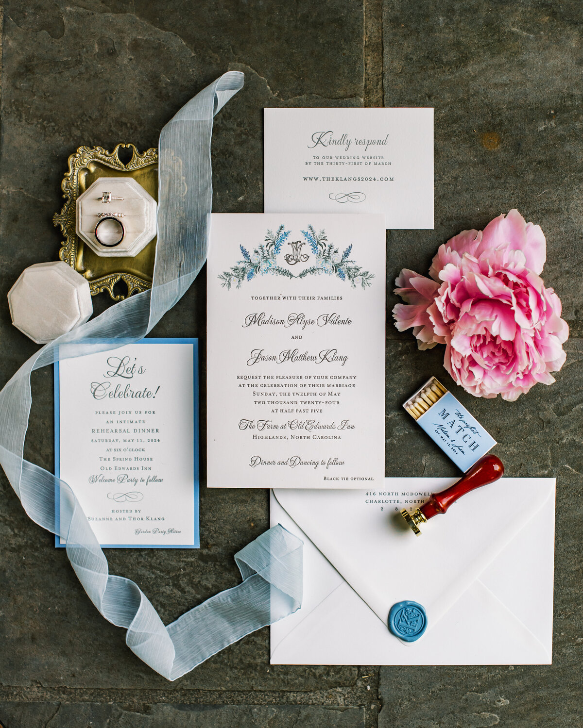 Blue and white floral wedding invitation suite with wax seal, pink peony, velvet ring box, and ribbon styled at Old Edwards Inn in Highlands, North Carolina.