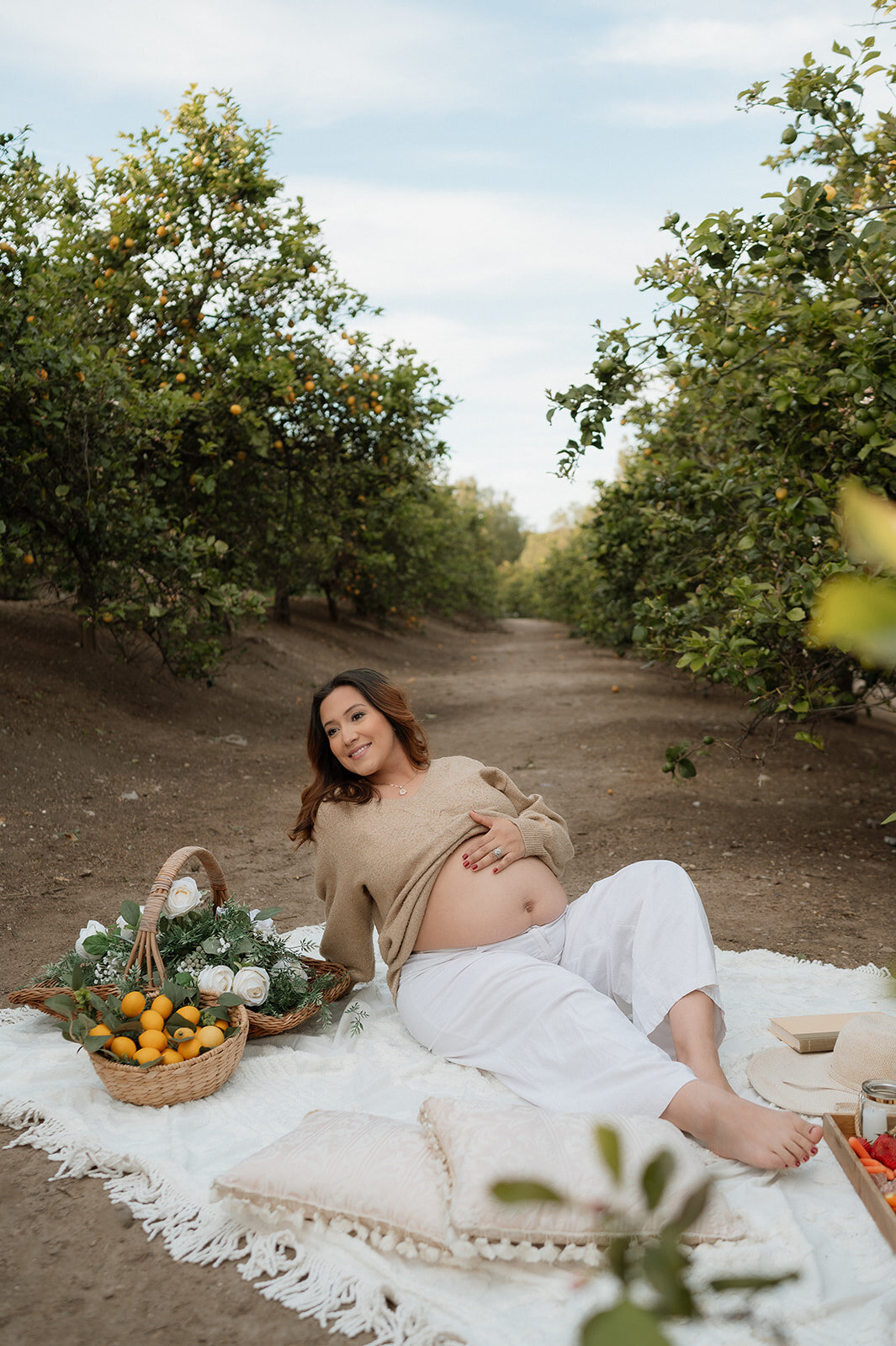 mom in orchard during motherhood session