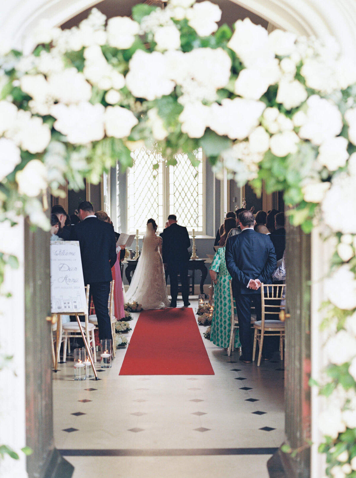 A wedding day photo of the bride and groom at the alter in Luttrellstown Castle