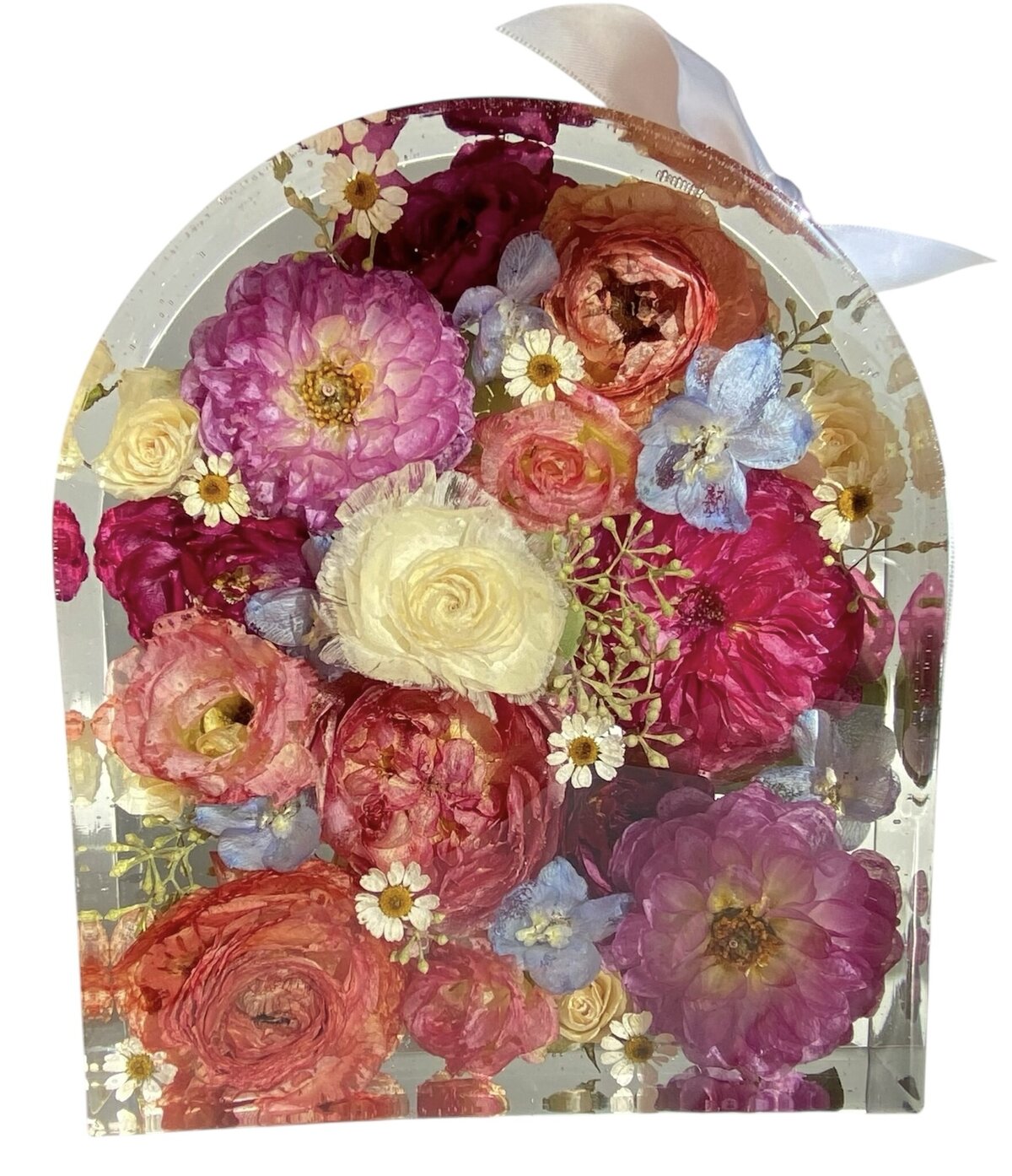 arch resin block with bright pink salmon blue and while wedding bouquet preserved as a timeless keepsake