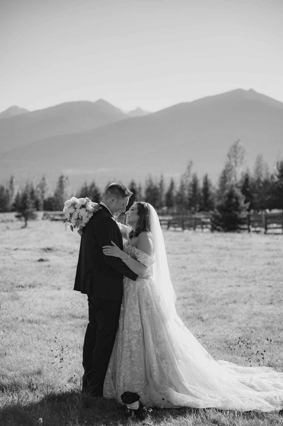 Couple hugging during golden hour mountain bridal portraits 