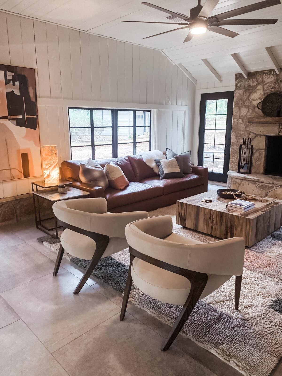 Neutral colour palette living room with seating and white panel walls