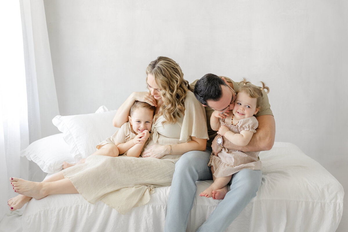 Classic studio maternity portrait of Katie and family, captured in natural light in Tampa