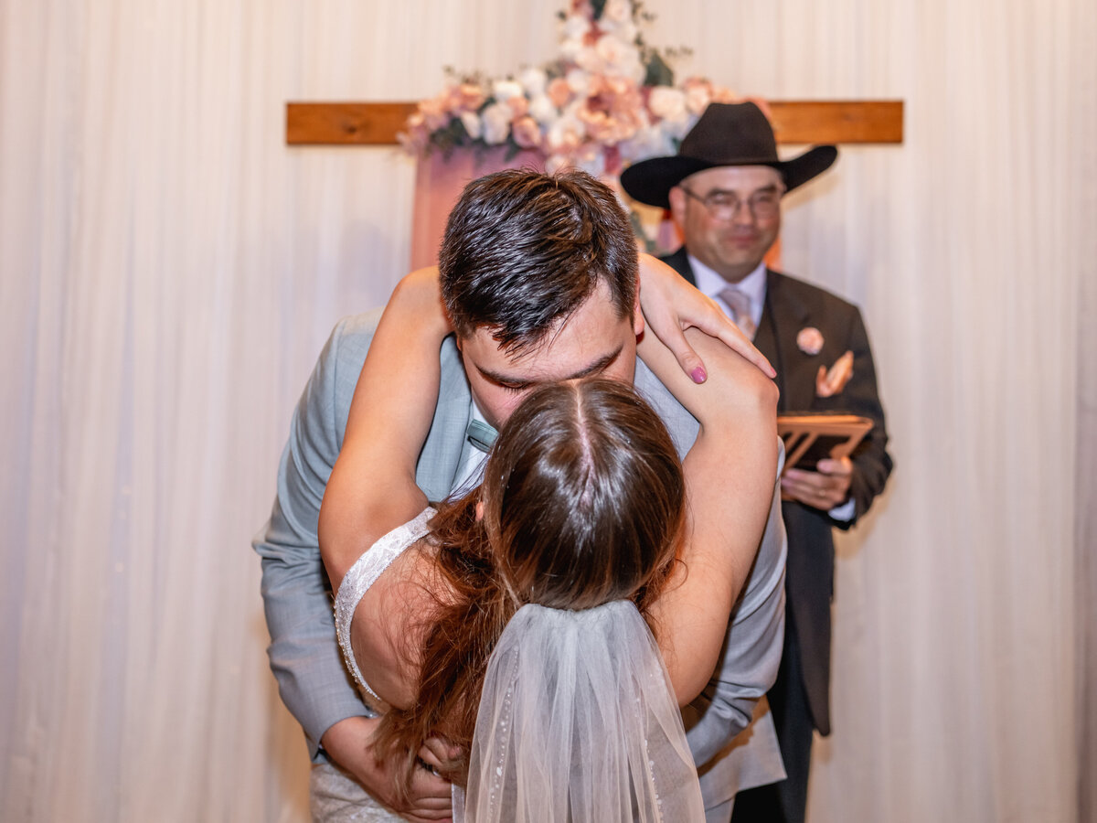 A passionate first kiss at the end of the ceremony during a SF wedding