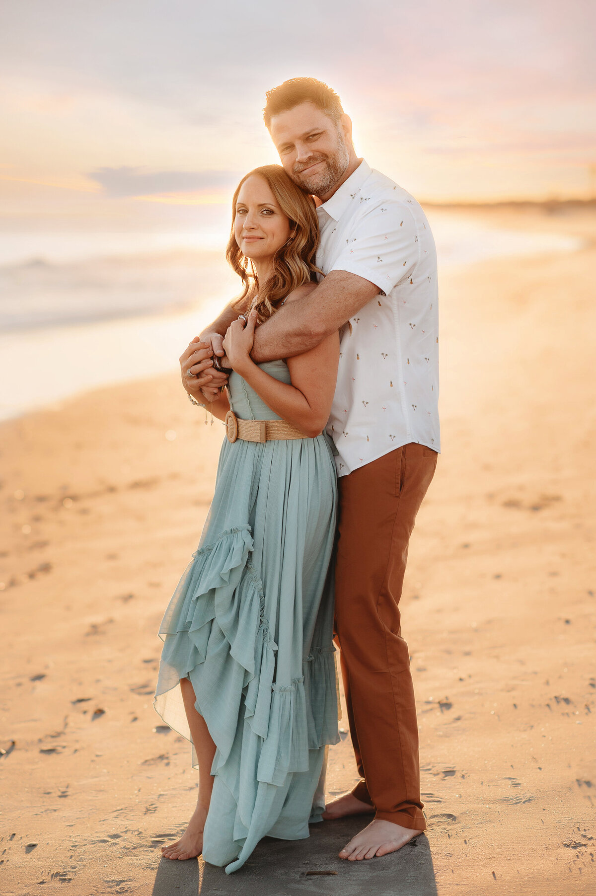 Couple embraces during Family Pictures in Isle of Palms.