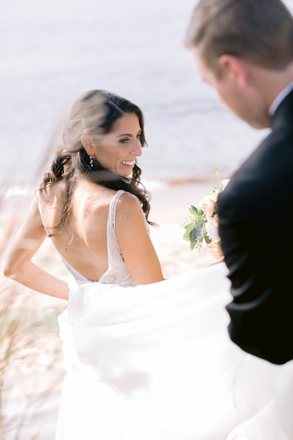 Bride looking back at groom