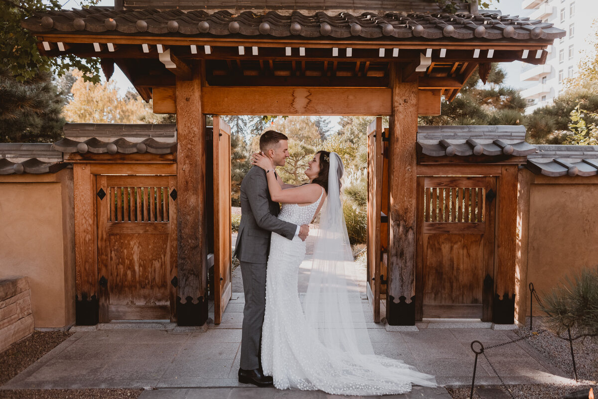 Bride and groom pose at the Denver Botanic Gardens in Denver, Colorado.