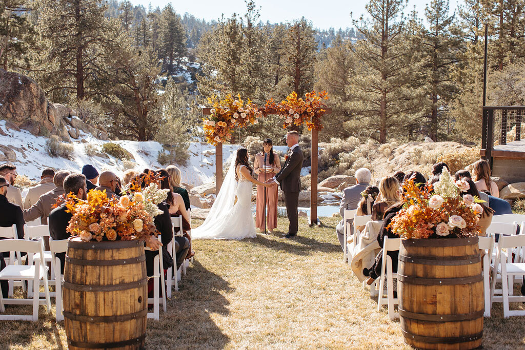 couple getting married in the mountains at Cienaga Creek Ranch in winter