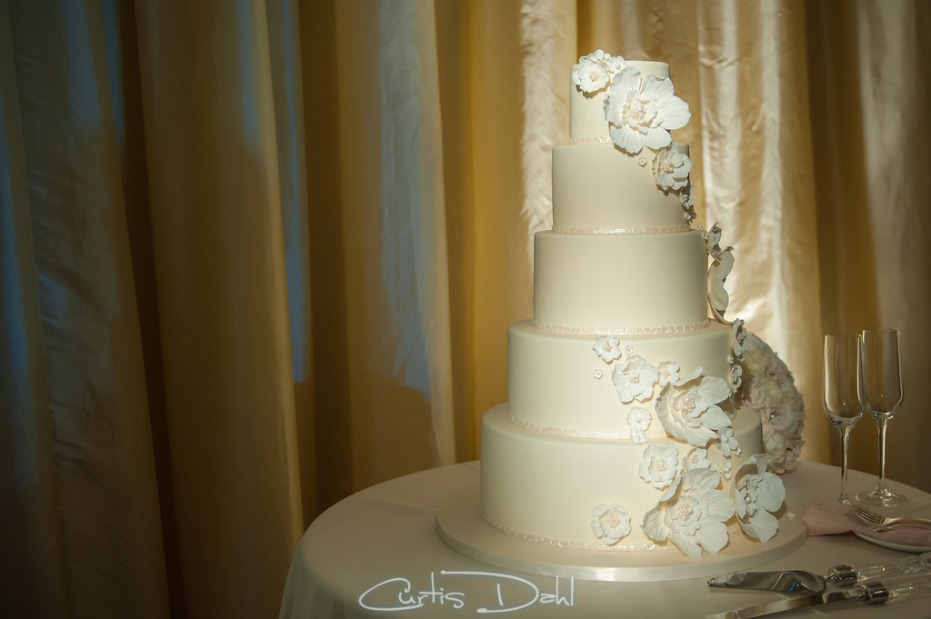 white wedding cake with fondant flowers