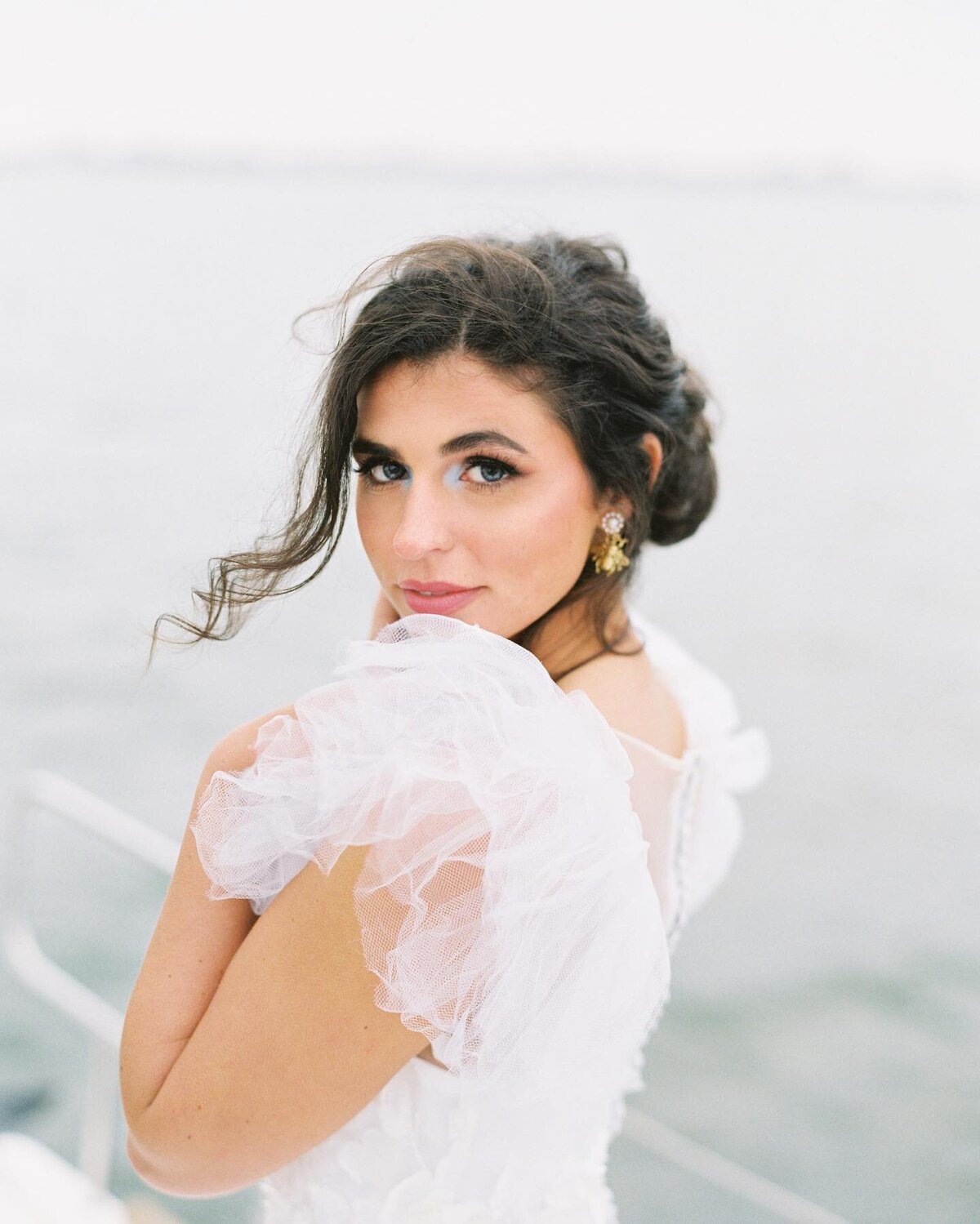 Engagement portrait on sail boat