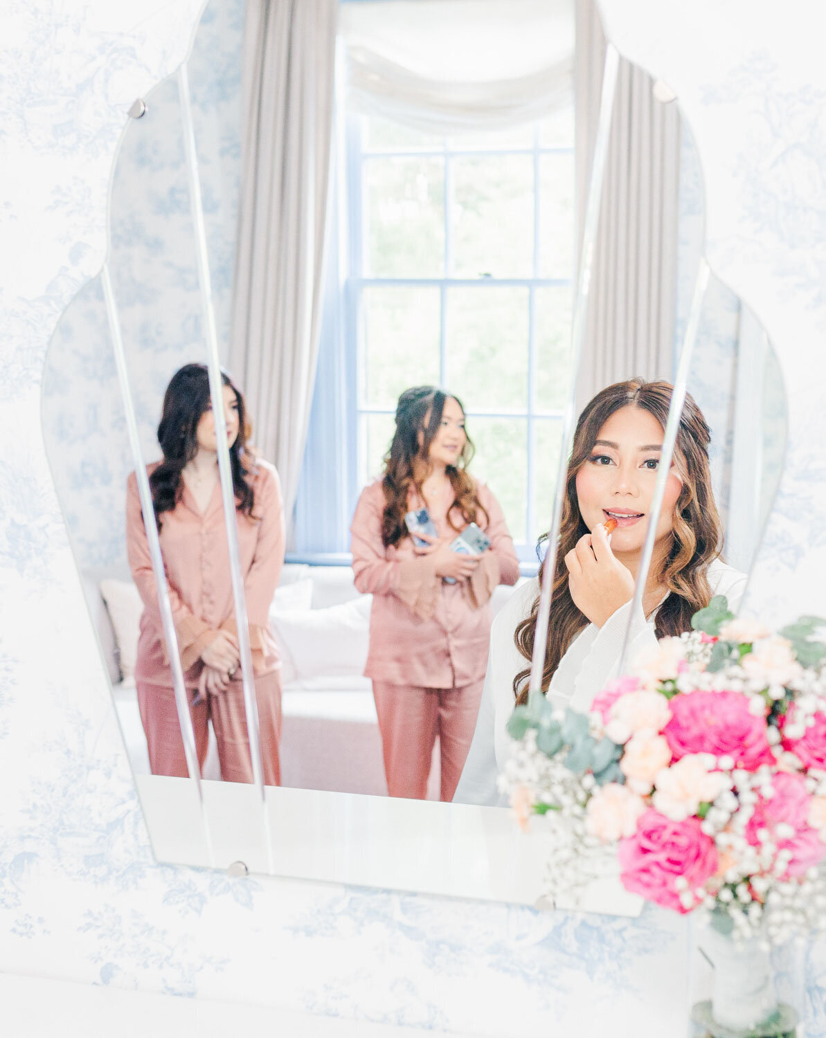 Bride getting ready and putting her lipstick on