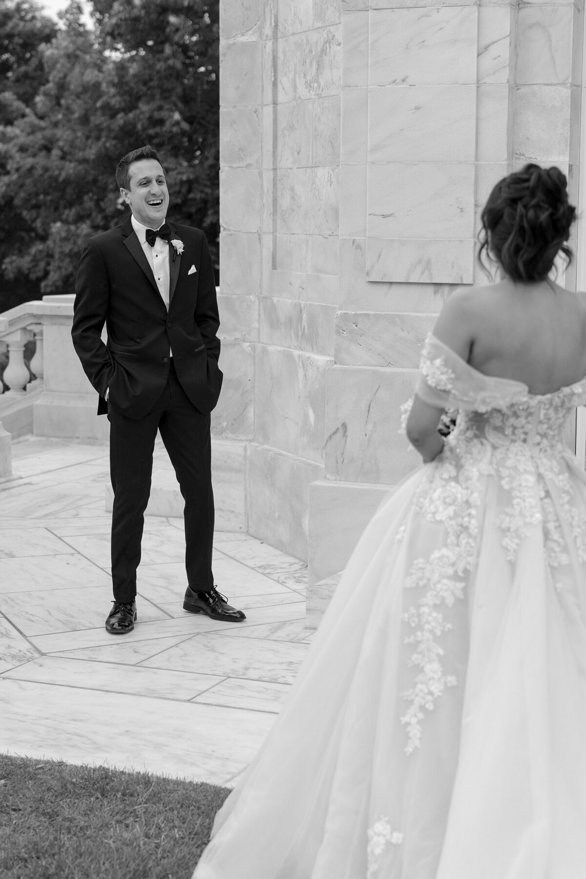 Groom reacts to seeing Bride in her wedding dress.
