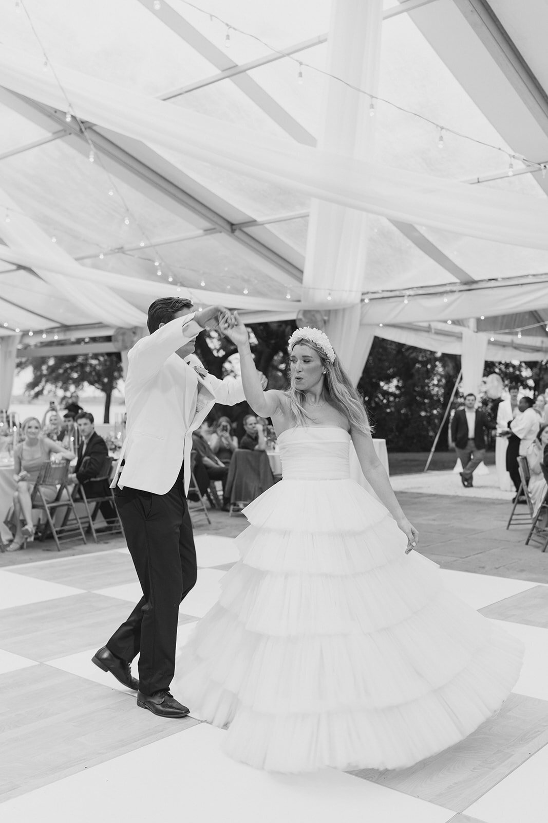 lowndes_grove_wedding_reception_first_dance_bride_spins_tulle_dress_black_and_white_charleston_kailee_dimeglio_photography--1290_websize