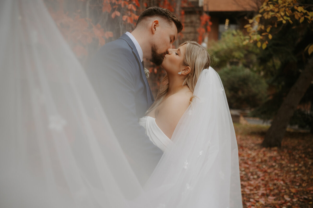 bride and groom portrait in the fall at the u of a
