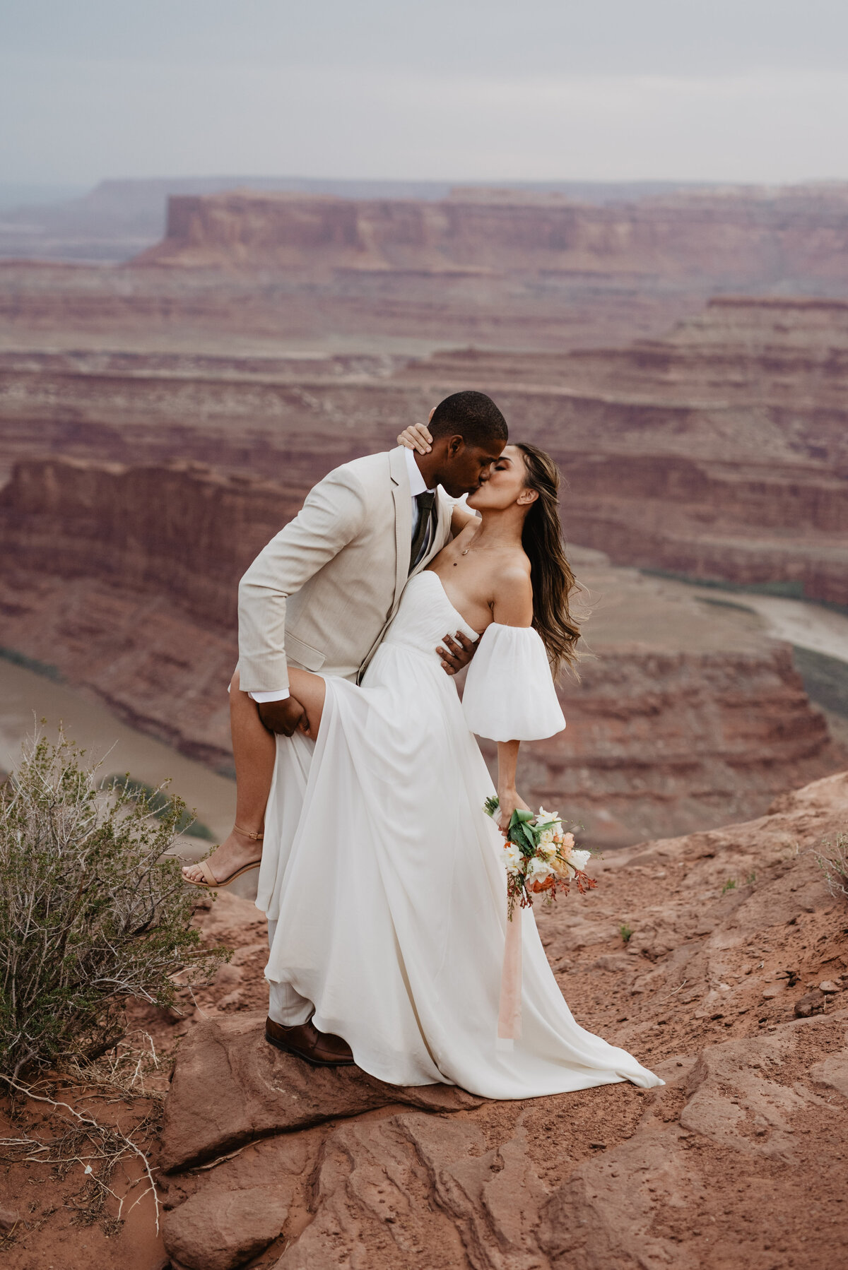 Utah Elopement Photographer captures groom holding bride