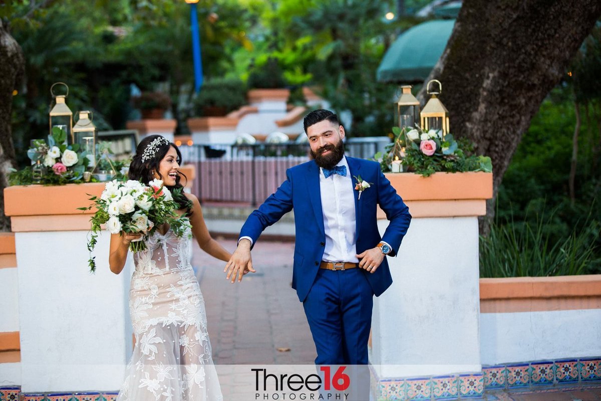 Bride and Royal Blue Tux dressed Groom enter their wedding reception