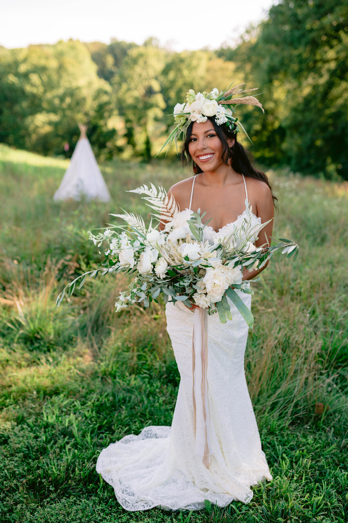 boho bride in a field