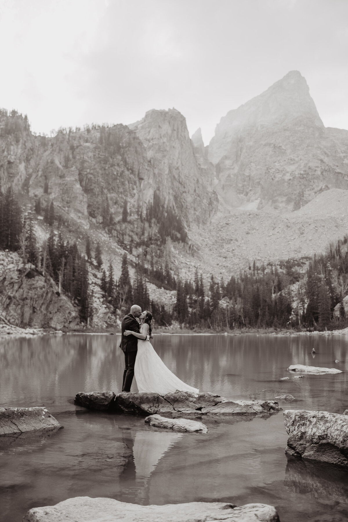 Jackson Hole Photographers capture couple kissing in black and white portrait