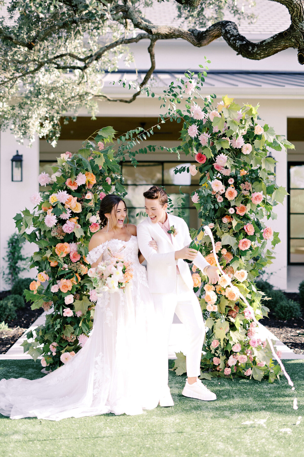 Elopement ceremony with a colorful floral arch