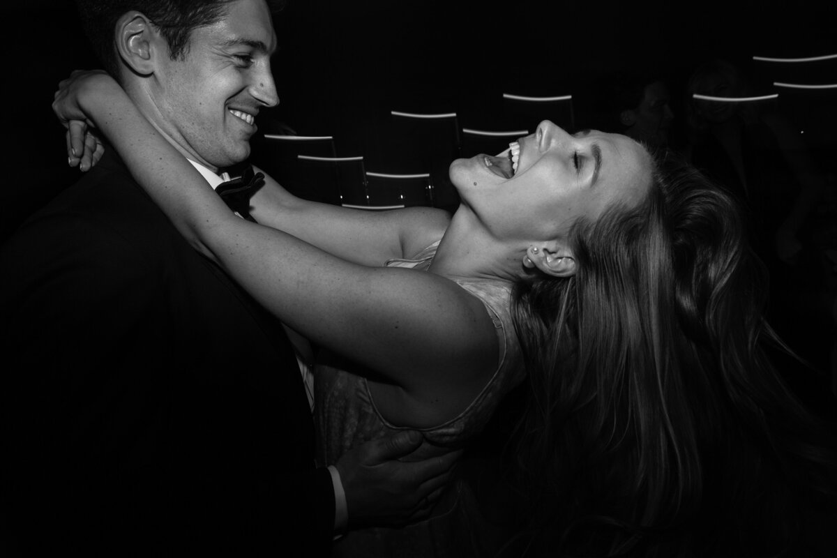 Happy couple dancing hard at a wedding
