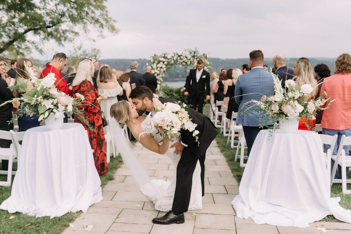 Groom dipping bride at Finger Lakes Wedding, new York