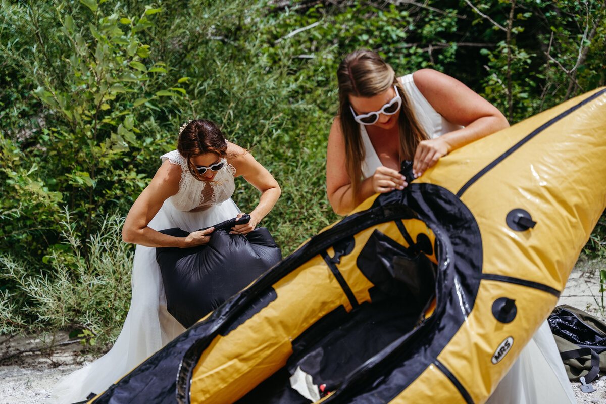 Brides paddling Soča Valley river elopement