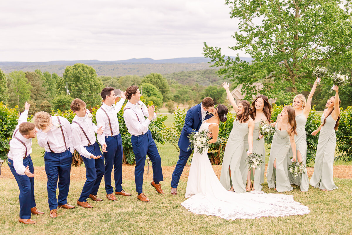 Groomsmen and bridesmaids celebrate with the bride and groom